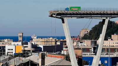 A vehicle sits short of a section of the Morandi highway bridge that collapsed on Aug. 15, 2018, in Genoa, northern Italy.