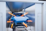 The EcoSmartCure straight-through oven reduces energy consumption through demand-based temperature control.