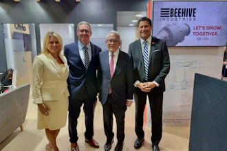 Leaders gather at the Farnborough International Airshow to announce Beehive Industries' $70 million expansion in Southwest Ohio. From left to right: Kimm Lauterbach, President and CEO of REDI Cincinnati; Gordie Follin, Chief Product Officer at Beehive Industries; Mike DeWine, Governor of Ohio; and J.P. Nauseef, President and CEO of JobsOhio.