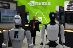 A worker stands near robots at the Nvidia booth during the China International Supply Chain Expo in Beijing on June 22, 2026.