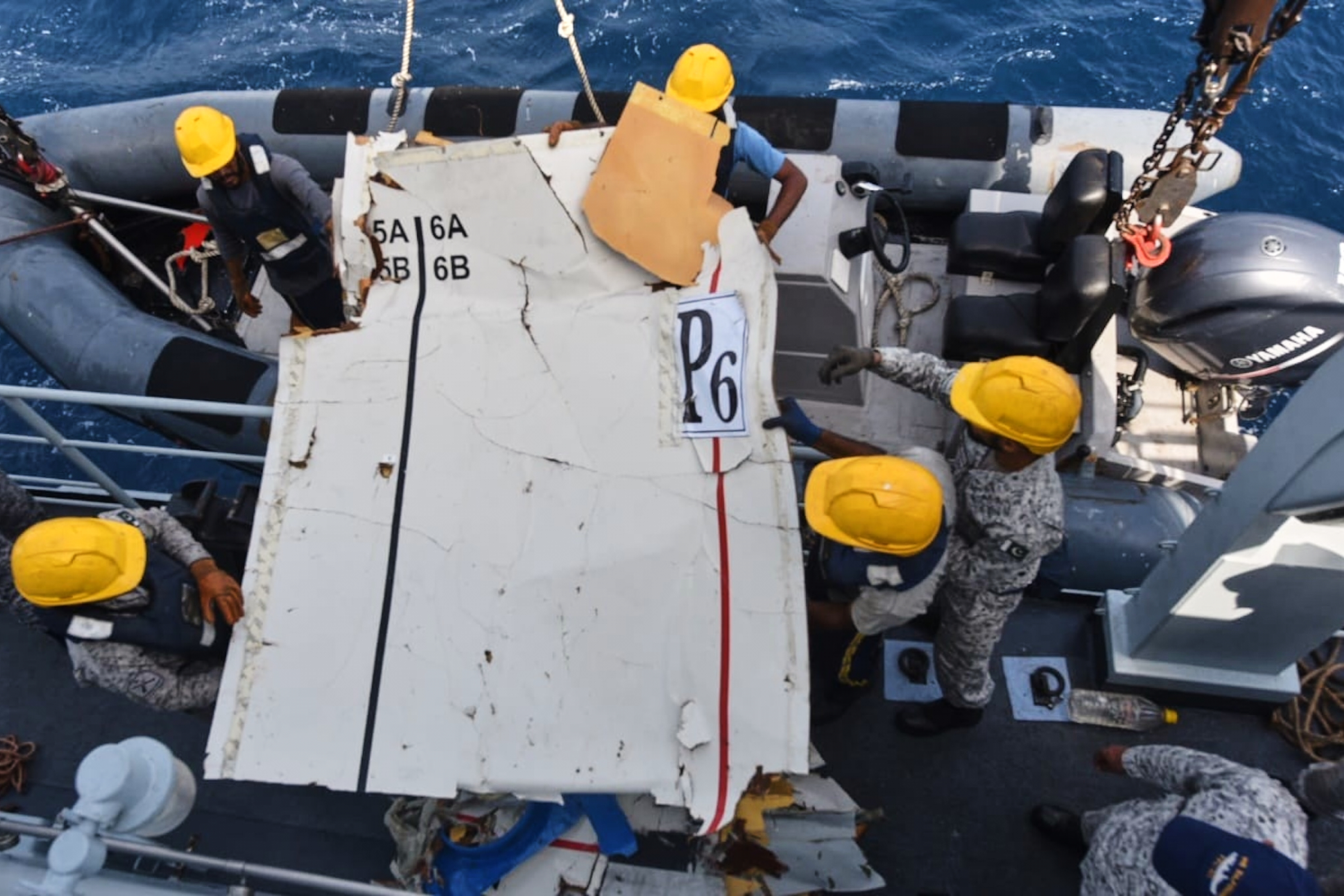 In this photo released by Pakistan Navy, Pakistan Navy personnel shift the wreckage of a cargo plane of the private carrier K2 Airways into a naval ship after recovering them from deep sea near Omara, a town some 360 kms. (220 miles) west of Karachi, Pakistan, Wednesday, July 8, 2026.