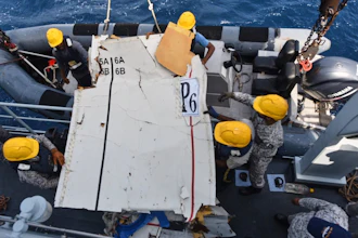 In this photo released by Pakistan Navy, Pakistan Navy personnel shift the wreckage of a cargo plane of the private carrier K2 Airways into a naval ship after recovering them from deep sea near Omara, a town some 360 kms. (220 miles) west of Karachi, Pakistan, Wednesday, July 8, 2026.