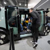 People view a Zoox self-driving vehicle at the company's booth during the CES tech show, Jan. 7, 2025, in Las Vegas.