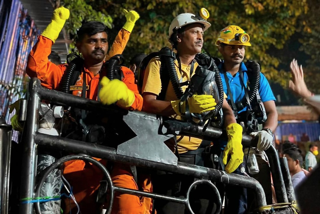 In this image provided by the Information and Public Relations Department, Government of Sikkim, rescue workers stand outside an under-construction tunnel at a hydropower project in Samardung village, about 40 kilometers (25 miles) from Gangtok, India, Wednesday, July 22, 2026.
