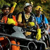 In this image provided by the Information and Public Relations Department, Government of Sikkim, rescue workers stand outside an under-construction tunnel at a hydropower project in Samardung village, about 40 kilometers (25 miles) from Gangtok, India, Wednesday, July 22, 2026.