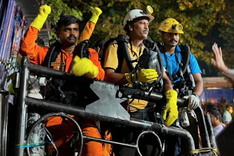 In this image provided by the Information and Public Relations Department, Government of Sikkim, rescue workers stand outside an under-construction tunnel at a hydropower project in Samardung village, about 40 kilometers (25 miles) from Gangtok, India, Wednesday, July 22, 2026.