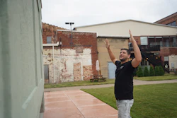 Wesley Mast, owner and president of Coppes Napanee, gestures next to a giant replica of a Hoosier cabinet (see below) in Nappanee, Ind., Thursday, Aug. 6, 2026.