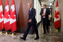 Prime Minister Mark Carney and Canada-U.S. Trade Minister Dominic LeBlanc arrive at a news conference on Parliament Hill, Ottawa, Aug. 22, 2026.