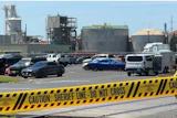 Yellow police tape is seen on May 27, 2026 outside the Longview, Wash. paper mill where a deadly chemical tank failure occurred.