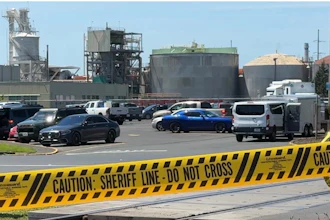 Yellow police tape is seen on May 27, 2026 outside the Longview, Wash. paper mill where a deadly chemical tank failure occurred.