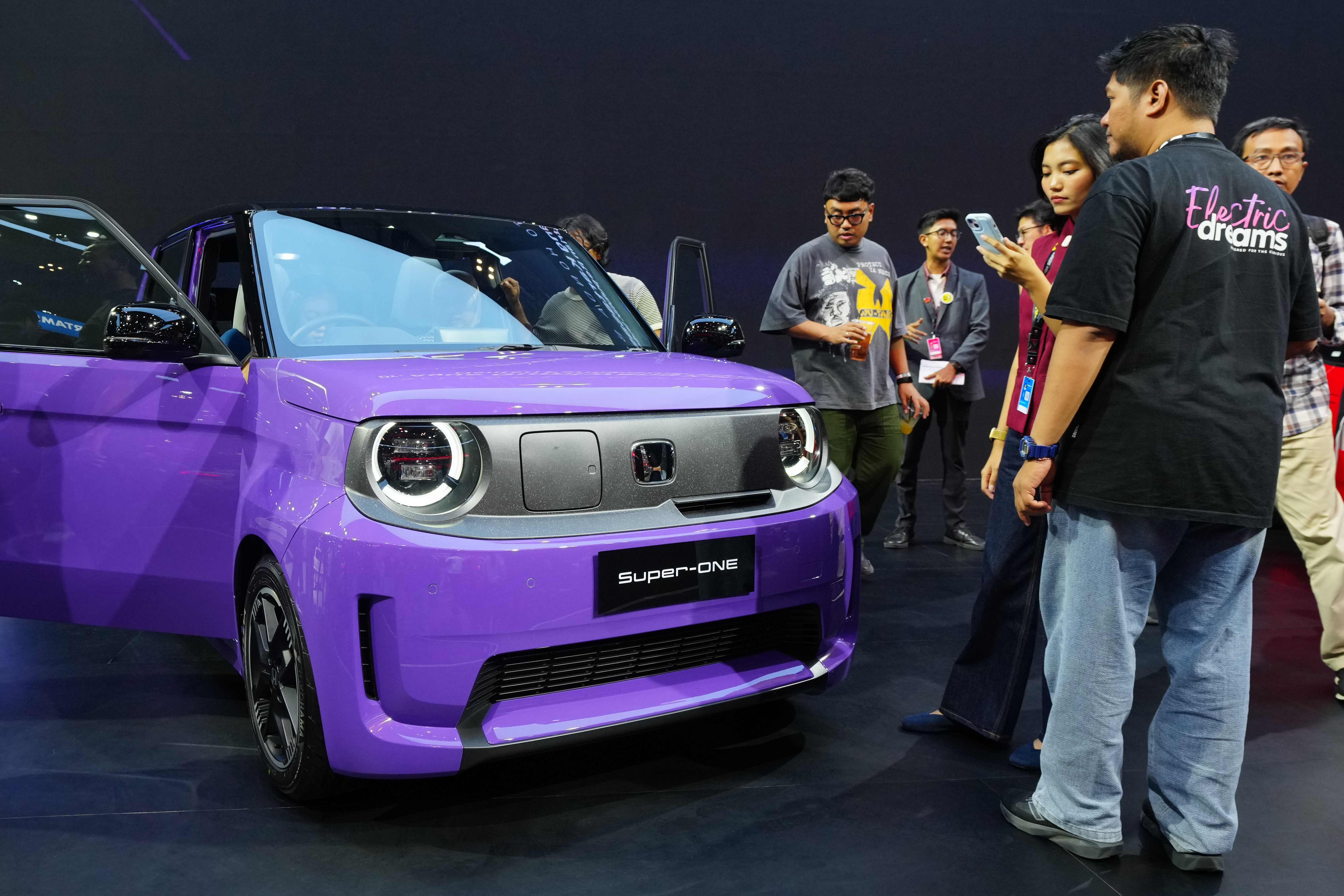 Visitors examine a Honda Super-One EV during the Indonesia International Auto Show organized by the Association of Indonesian Automotive Industries (GAIKINDO) in Tangerang, Indonesia, Thursday, July 30, 2026.