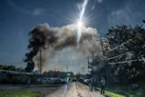 Firefighters work to put out a blaze after an explosion at Brent Industries, Tuesday, Aug. 18, 2026, in Toledo, Ohio.