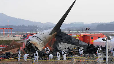 Rescue team members work at the site of a plane crash at Muan International Airport in Muan, South Korea on Dec. 31, 2024.