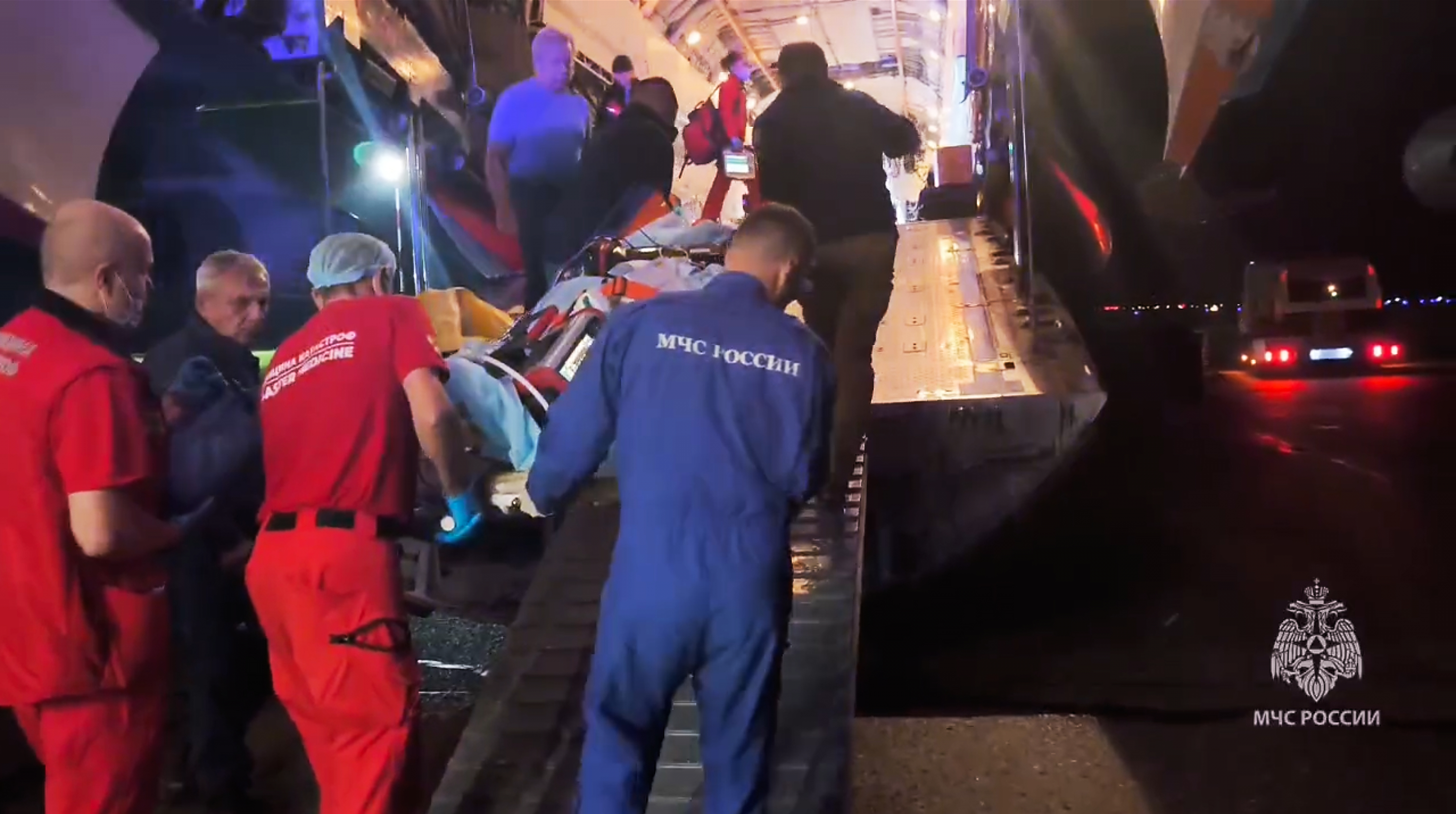 In this image made from video provided by Russian Emergency Situations Ministry press service, medical and rescue workers put those injured in a fire at the Amur Gas Chemical Complex on a plane to Moscow in Blagoveschensk, Amur region, Russia, Thursday, Aug. 27, 2026.