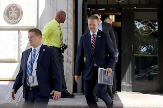 United States Trade Representative Jamieson Greer, center, leaves the U.S. Department of Commerce following a meeting with Canadian officials, in Washington, Monday, Aug. 17, 2026.