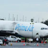 Workers inspect an Amazon cargo plane that overshot a runway four days ago at Miami International Airport, Thursday, Sept. 10, 2026, in Miami.