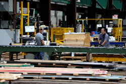 Workers in the manufacturing plant of Ideal Roofing, Ottawa, Aug. 25, 2026.