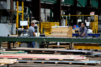 Workers in the manufacturing plant of Ideal Roofing, Ottawa, Aug. 25, 2026.