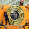 Workers install a tunnel‑boring machine at a factory in Jinhu county in eastern China's Jiangsu province on Aug. 25, 2026.