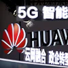 Signs promoting 5G wireless technology from Chinese technology firm Huawei are displayed at the PT Expo in Beijing on Sept. 26, 2018.