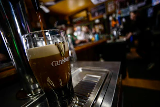 A pint of Guinness beer is poured on St. Patrick's Day on March 17, 2023, in Bellows Falls, Vt.