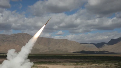 A Northrop Grumman-built solid rocket motor powering a Guided Multiple Launch Rocket System (GMLRS) missile for the U.S. Army.