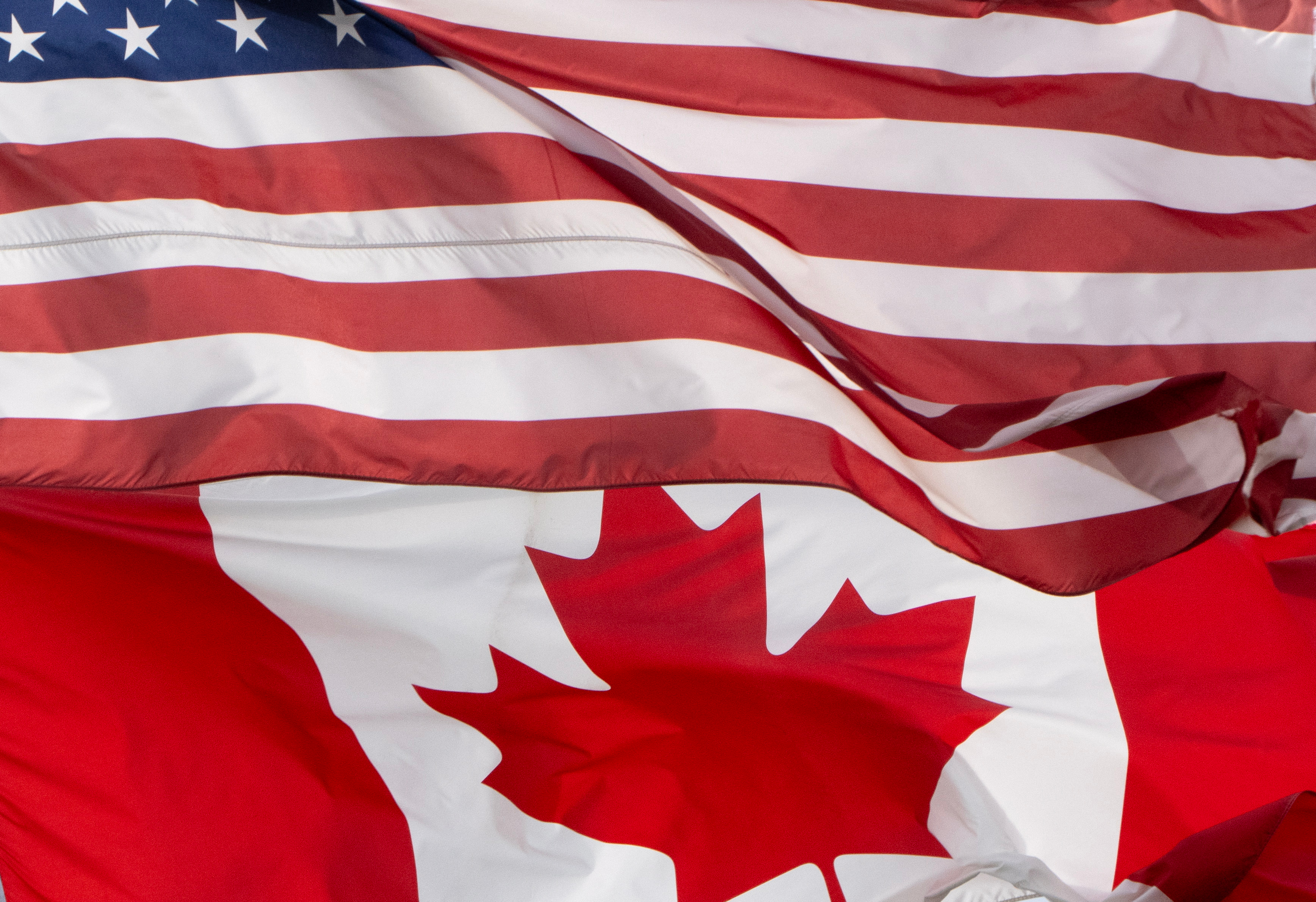 The flags of Canada and the United States fly over a stadium in Ottawa, Saturday, Sept. 12, 2026.