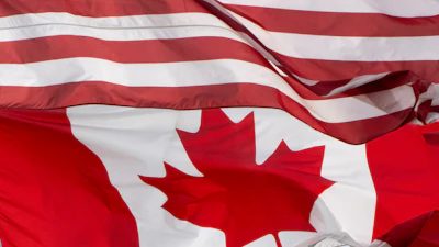 The flags of Canada and the United States fly over a stadium in Ottawa, Saturday, Sept. 12, 2026.
