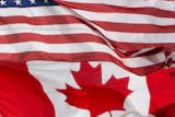 The flags of Canada and the United States fly over a stadium in Ottawa, Saturday, Sept. 12, 2026.
