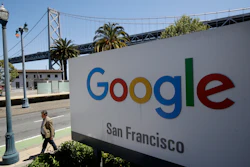 Google San Francisco sign with Bay Bridge visible in background