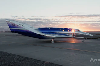 Virgin Galactic SpaceShipTwo aircraft on runway at sunset with illuminated cabin windows