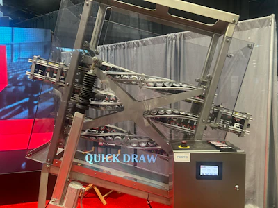 Industrial robotic arm system labeled 'Quick Draw' with Festo controller in exhibition enclosure