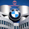 BMW logo mounted on modern building with cylindrical towers and blue sky background