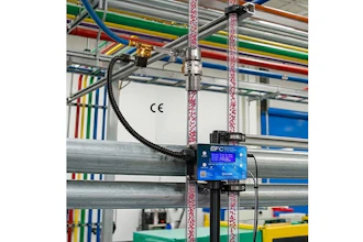 EFC blue control device mounted on industrial factory equipment with colorful overhead cables and structural beams