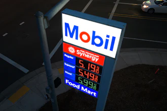 Mobil gas station price sign displaying fuel prices with Synergy branding and Food Mart services