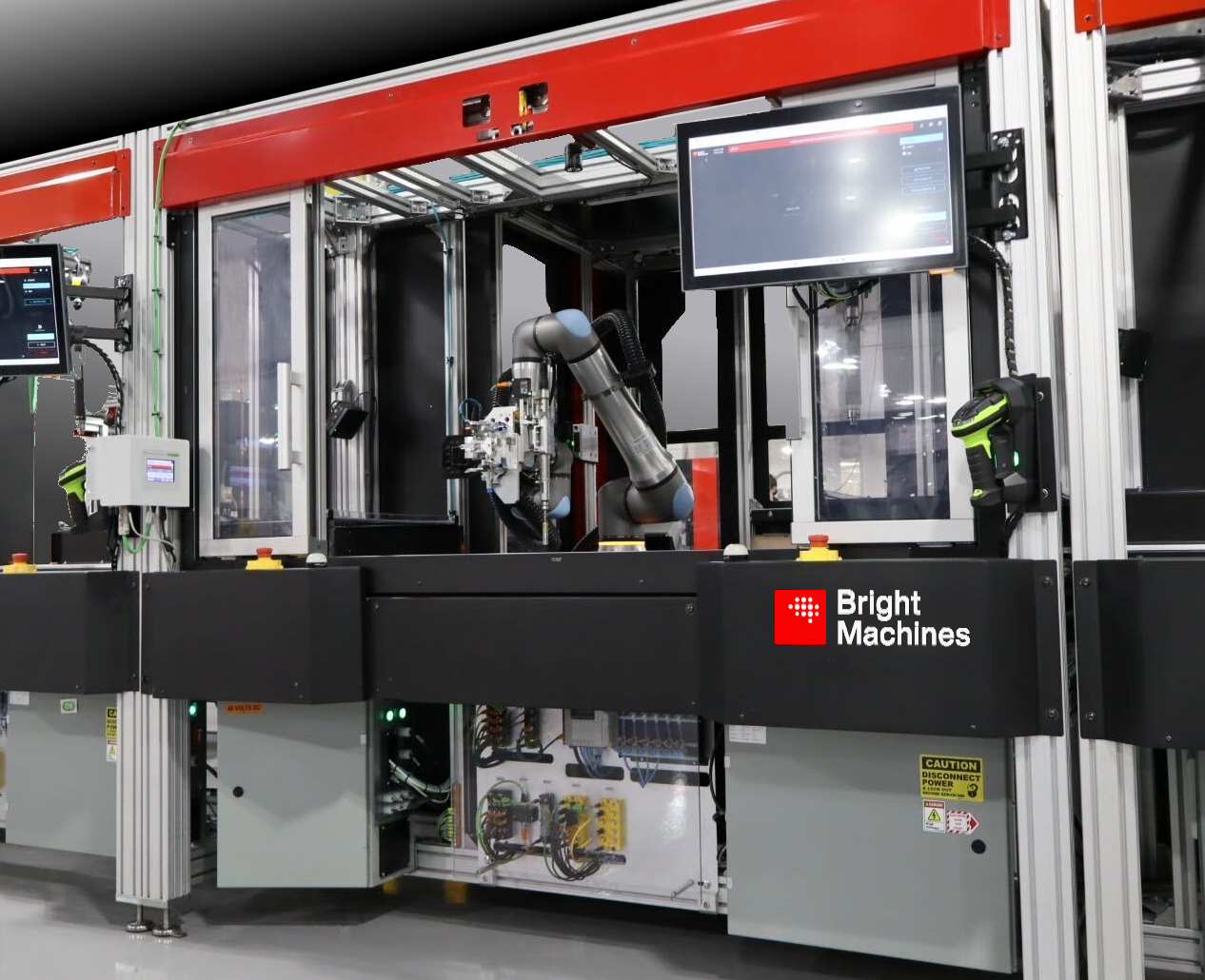 Bright Machines industrial robotic assembly system with red frame, articulated robot arm, and integrated control display