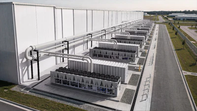 Industrial facility with rows of large rectangular structures under white roof framework and connecting piping systems