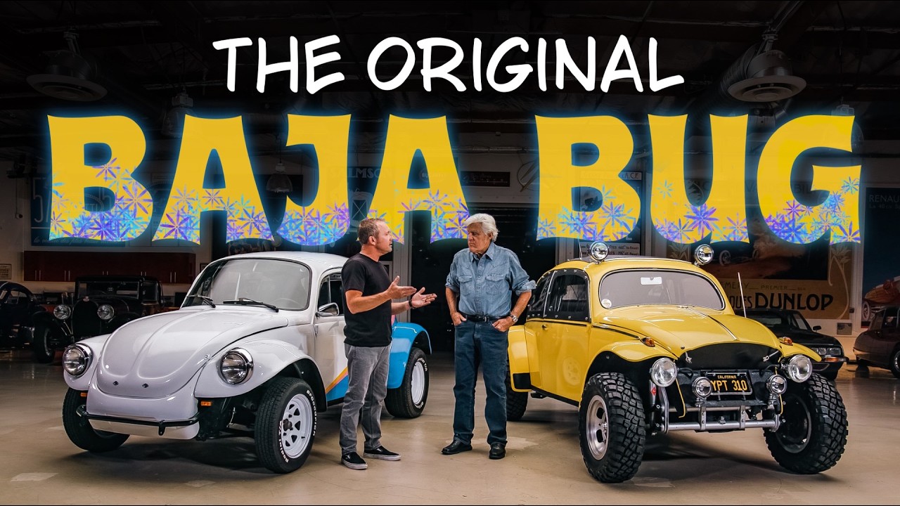 Two men stand between a white and yellow modified Baja Bug vehicles in a garage workshop setting.