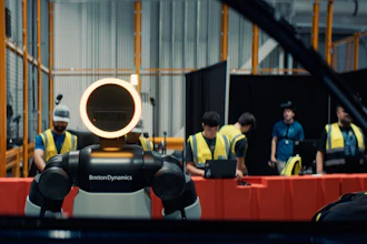 Boston Dynamics robot Spot with glowing head ring displayed at industrial facility with workers in safety vests observing
