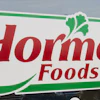 Hormel Foods storefront sign with red text and green decorative border featuring parsley leaf icon
