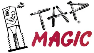 Tap Magic logo featuring a smiling wrench mascot with geometric text design in black and red